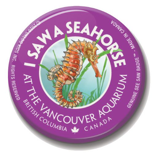 A purple button with an image of a sea horse.