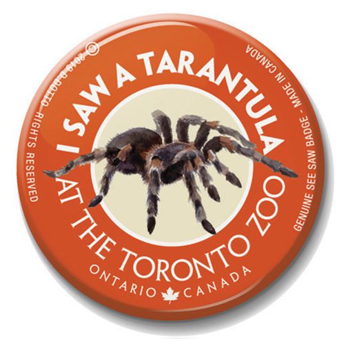 A button with an image of a tarantula on it.