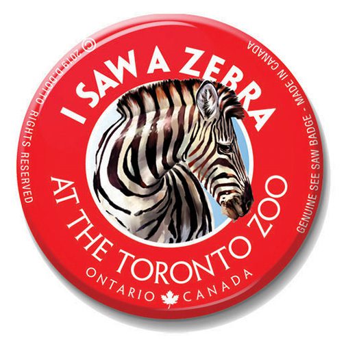 A red button with a picture of a zebra on it.